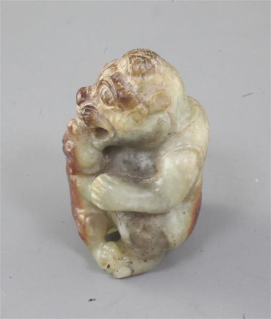 A Chinese greenish-yellow and russet jade group of a bear and cub, Han dynasty or later 4.5cm